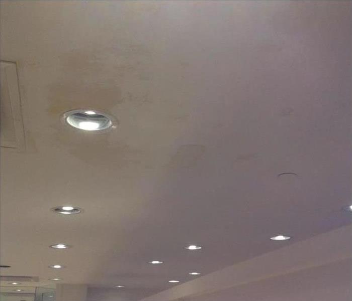 Water damage on dressing room ceiling. 